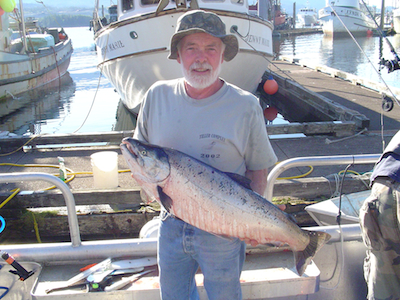 uncle erwin holding coho on sunny day
